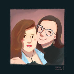 Portrait of Mornia and Fleur, two with people with long hair and glasses, smiling in each other's arms